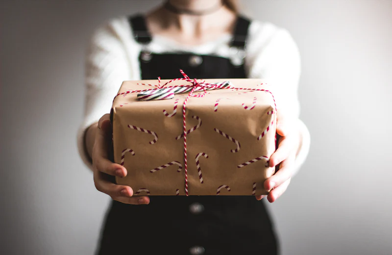 A wrapped gift being handed over