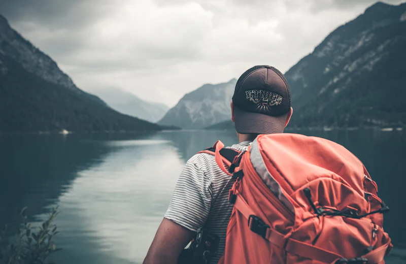 A traveller looking out over a lake